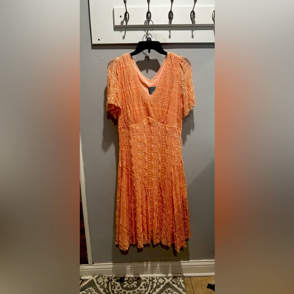 A light coral dress that is perfect for any occasion